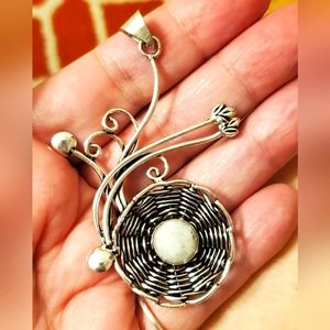 Artisan bird's nest and white quartz egg.